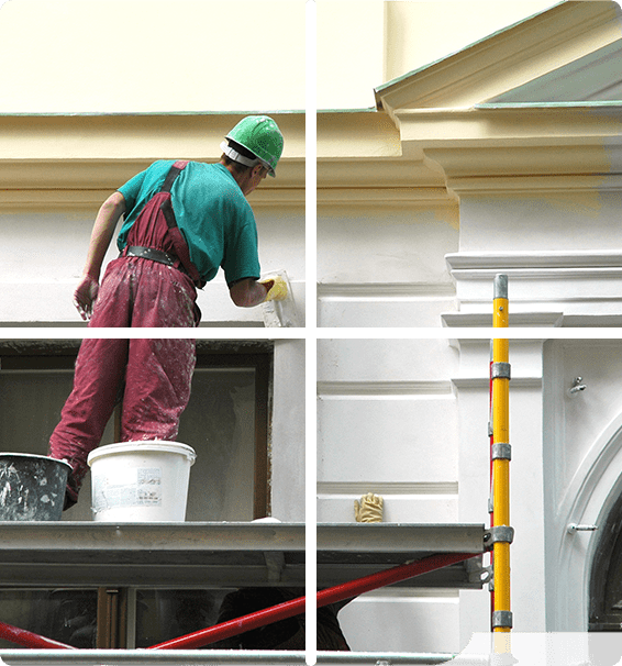 A man painting the wall of a building.