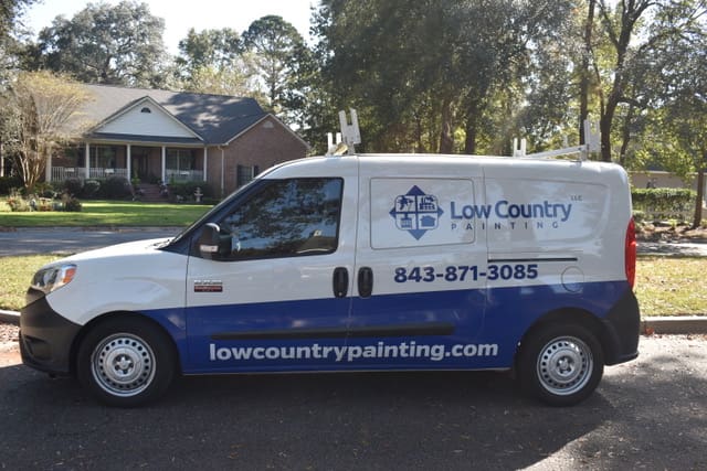 A van with the words low country painting on it.