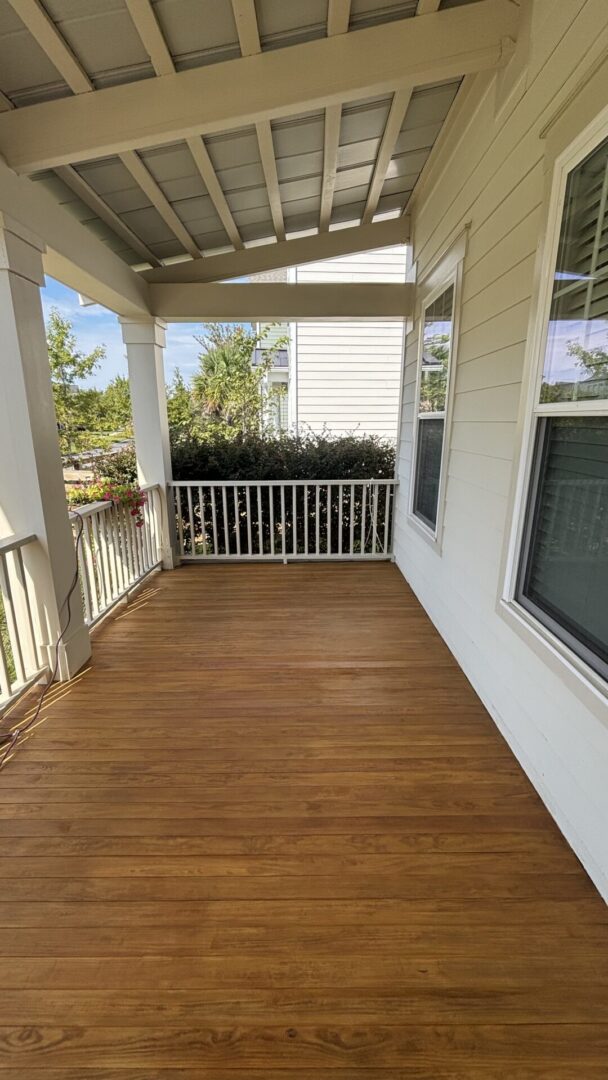 Front porch floor after deck staining with DEFY semi-transparent stain in Carnes Crossroads, Summerville, SC.